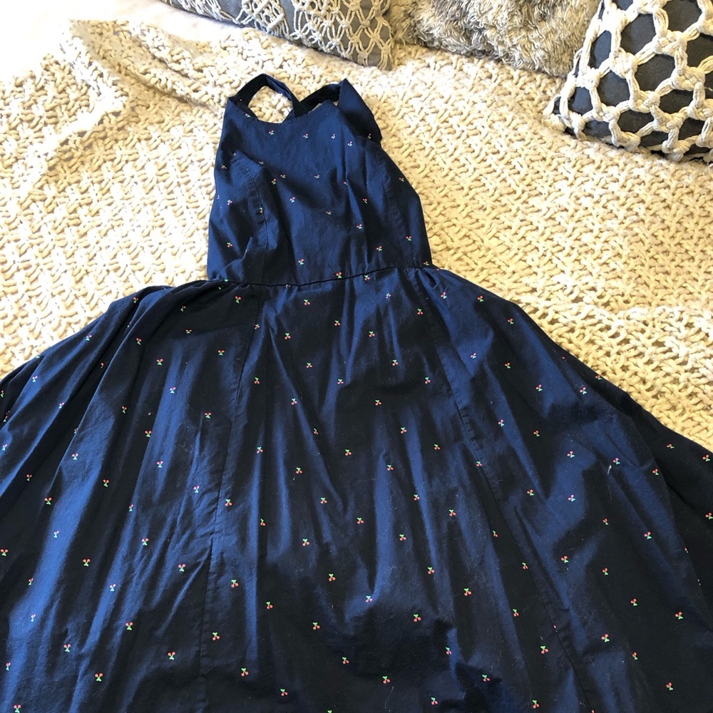 Adorable dress with cherries and a crisscross back!